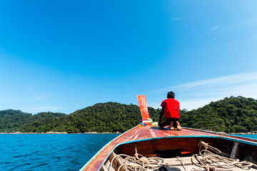 Tropical beach, traditional long tail boats, Andaman Sea, Thailand.