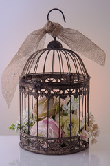 Caged atrificial flowers