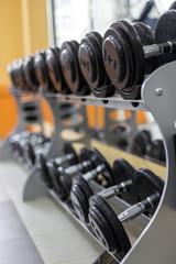 dumbbells row in fitness center