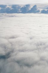 Aerial view from the plane of fluffy rain cloud in daytime - Cloudscape