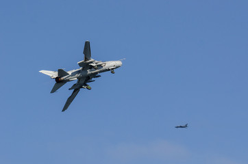 ATTACK AIRCRAFT - Two military planes in the blue sky
