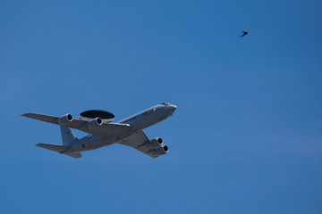 Fototapeta na wymiar Military radar plane and a bird