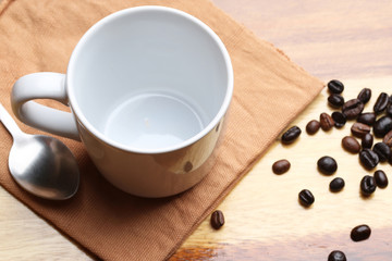 empty white coffee cup on wood background