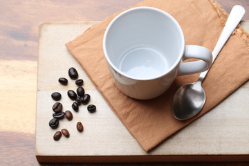 empty white coffee cup on wood background