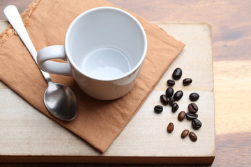 empty white coffee cup on wood background