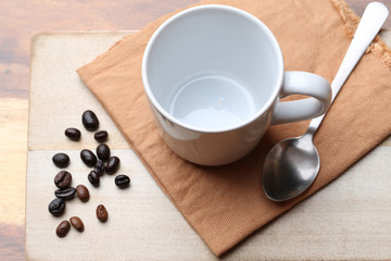 empty white coffee cup on wood background