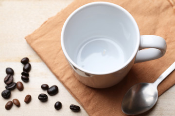 empty white coffee cup on wood background