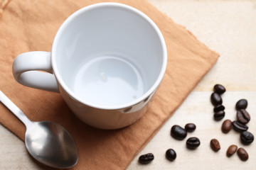 empty white coffee cup on wood background