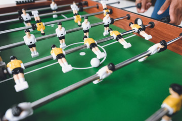 close up view of man playing table football during break