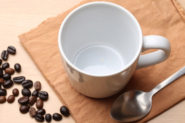 Obraz na płótnie Canvas empty white coffee cup on wood background