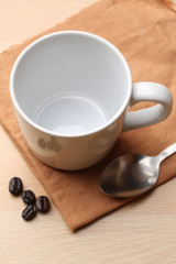 empty white coffee cup on wood background