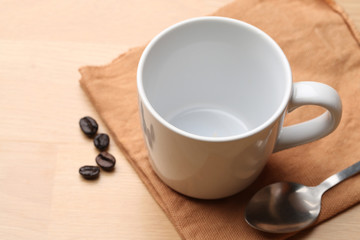 empty white coffee cup on wood background
