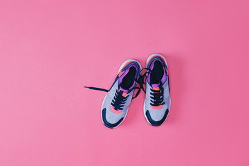 top view of pair of sneakers for fitness isolated on pink - obrazy, fototapety, plakaty