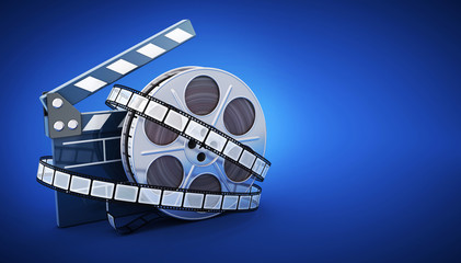 Spool and film on blue background