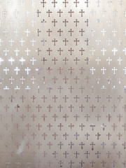 the cross pattern on frosted glass texture with soft light from background