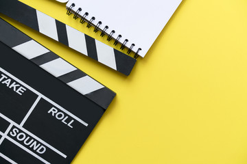 Fototapeta premium movie clapper on yellow background