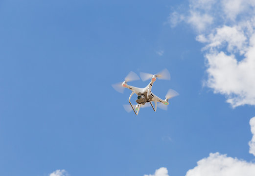 Drone quad copter against a blue sky