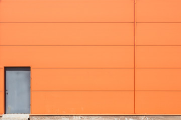 Orange wall with metal doors
