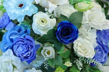 Artificial colorful of Rose flower decor background for text message.