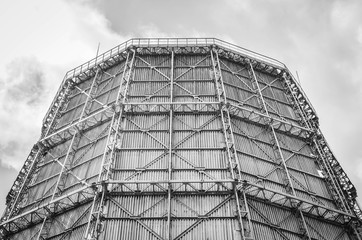 Close up industrial view cooling tower at metallurgical plant with cloudy sky