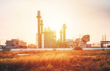 Petrochemical plant in silhouette image at sunset,Glow light of petrochemical industry on sunset and Twilight sky ,Power plant,Energy power station area