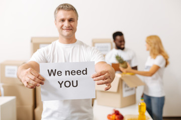 Handsome nice guy encouraging volunteering
