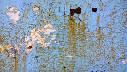 Old blue paint peeling texture. Vintage grunge background