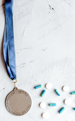 Concept of doping in sport - deprivation medals top view
