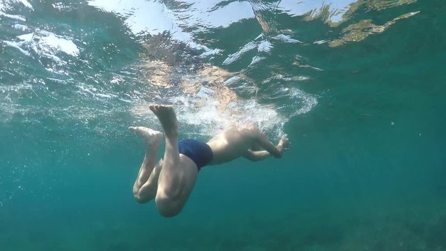 swimmer swims into the sea