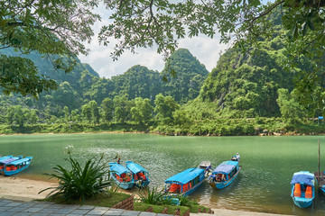 River to the Phong Nha cave with boats in the National Park of Phong Nha Ke Bang, Vietnam.