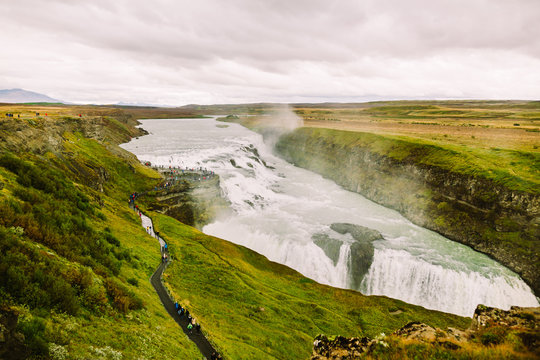 Gullfoss waterfall in Golden Circle popular tourist route in the canyon of the Hvítá river in southwest Iceland.Long exposure panorama of beautiful popular iconic Gullfoss cascade fall.