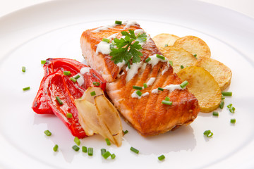 Salmon Steak with Vegetables and fried potatoes.
