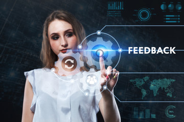 The concept of business, technology, the Internet and the network. A young entrepreneur working on a virtual screen of the future and sees the inscription: Feedback
