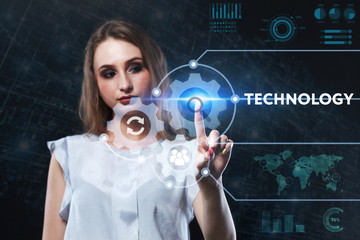 The concept of business, technology, the Internet and the network. A young entrepreneur working on a virtual screen of the future and sees the inscription: Technology