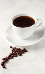 Coffee cup and beans on a white background.