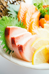 Raw and fresh mixed sashimi with salmon , tuna , hamaji and other