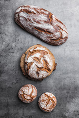 Delicious fresh bread on rustic background