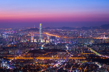 Fototapeta na wymiar Downtown Seoul skyline and skyscraper after sunset, The best view of South Korea at Namhansanseong Fortress.