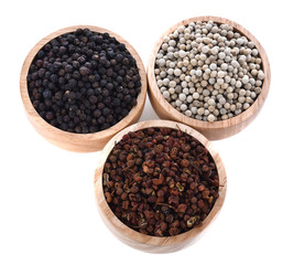 Front view of  3 organic  pepper Piper nigrum in wood bowl