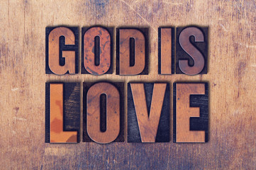 God Is Love Theme Letterpress Word on Wood Background © enterlinedesign