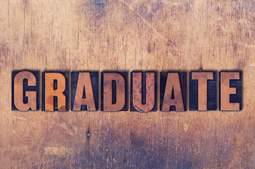 Graduate Theme Letterpress Word on Wood Background
