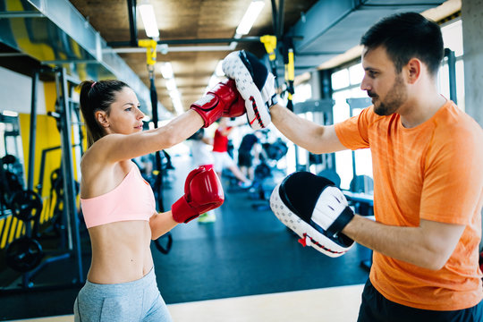 Picture Of Woman Boxing With Her Trainer