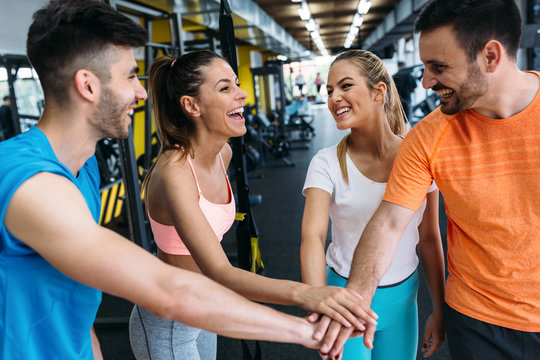 Picture of cheerful fitness team in gym