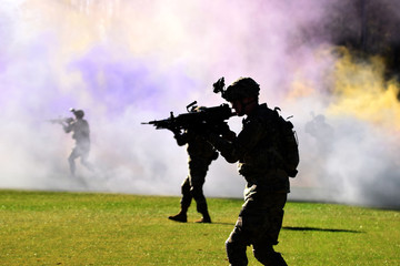 Soldier walking through smoke