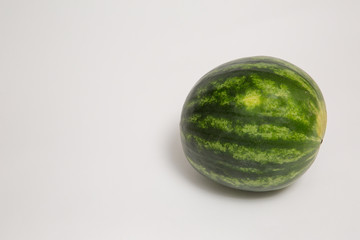 small whole watermelon isolated on white background