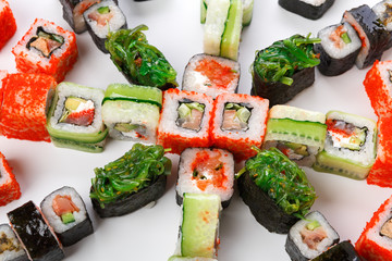 Set of sushi, maki and rolls on white background