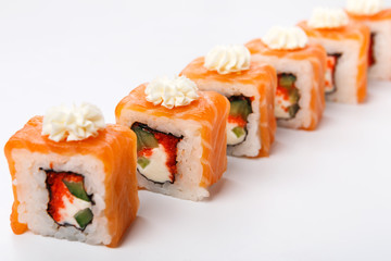 Set of salmon rolls on white, closeup, pov