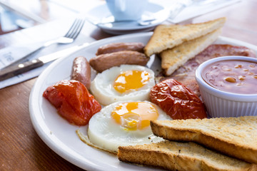 classical english breakfast with egg and fries