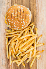 Obraz na płótnie Canvas Cheese burger - American cheese burger with Golden French fries