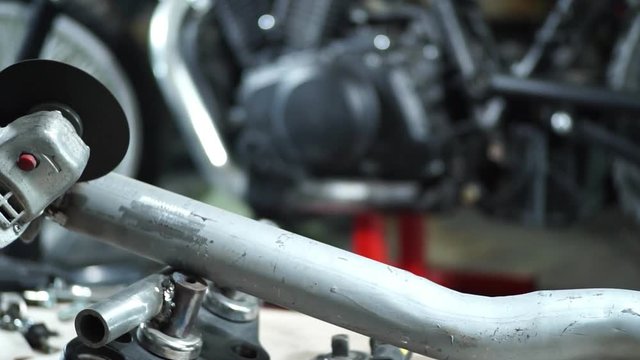 the mechanic works with metal sparks.